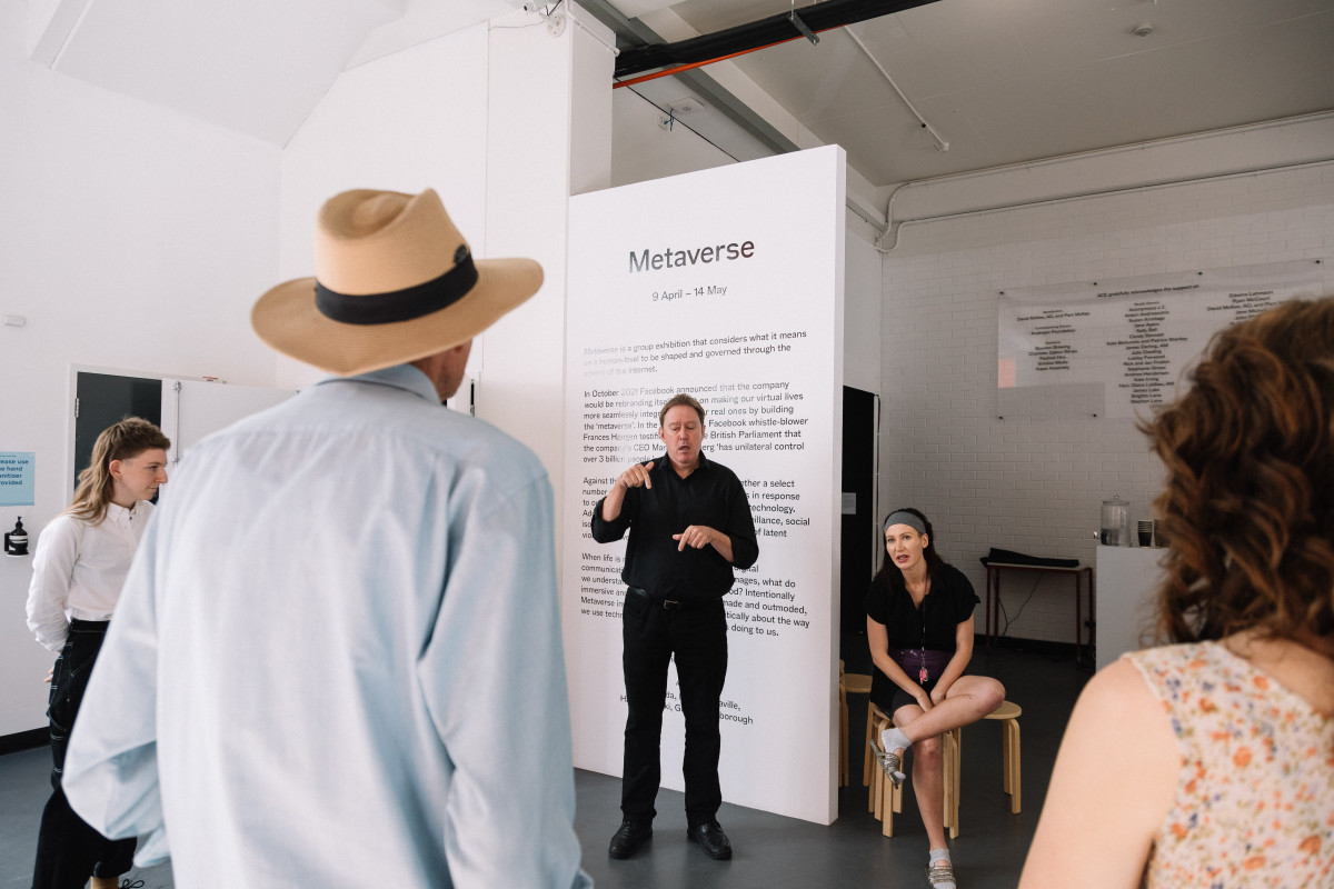 Auslan interpreter and artist Giselle Stanborough communicating with audience.