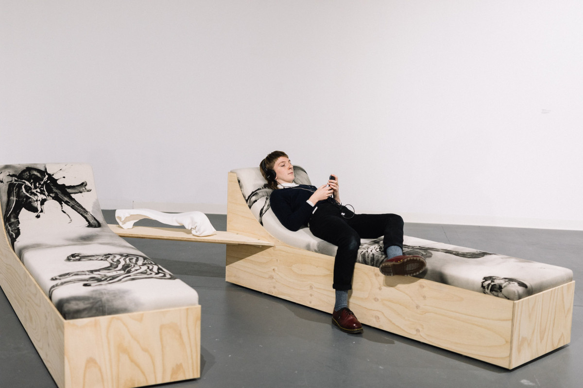 Gallery visitor engages with works for the 'Message from the Meadow' exhibition by 2021 Porter Street Commission recipient, Bridget Currie.