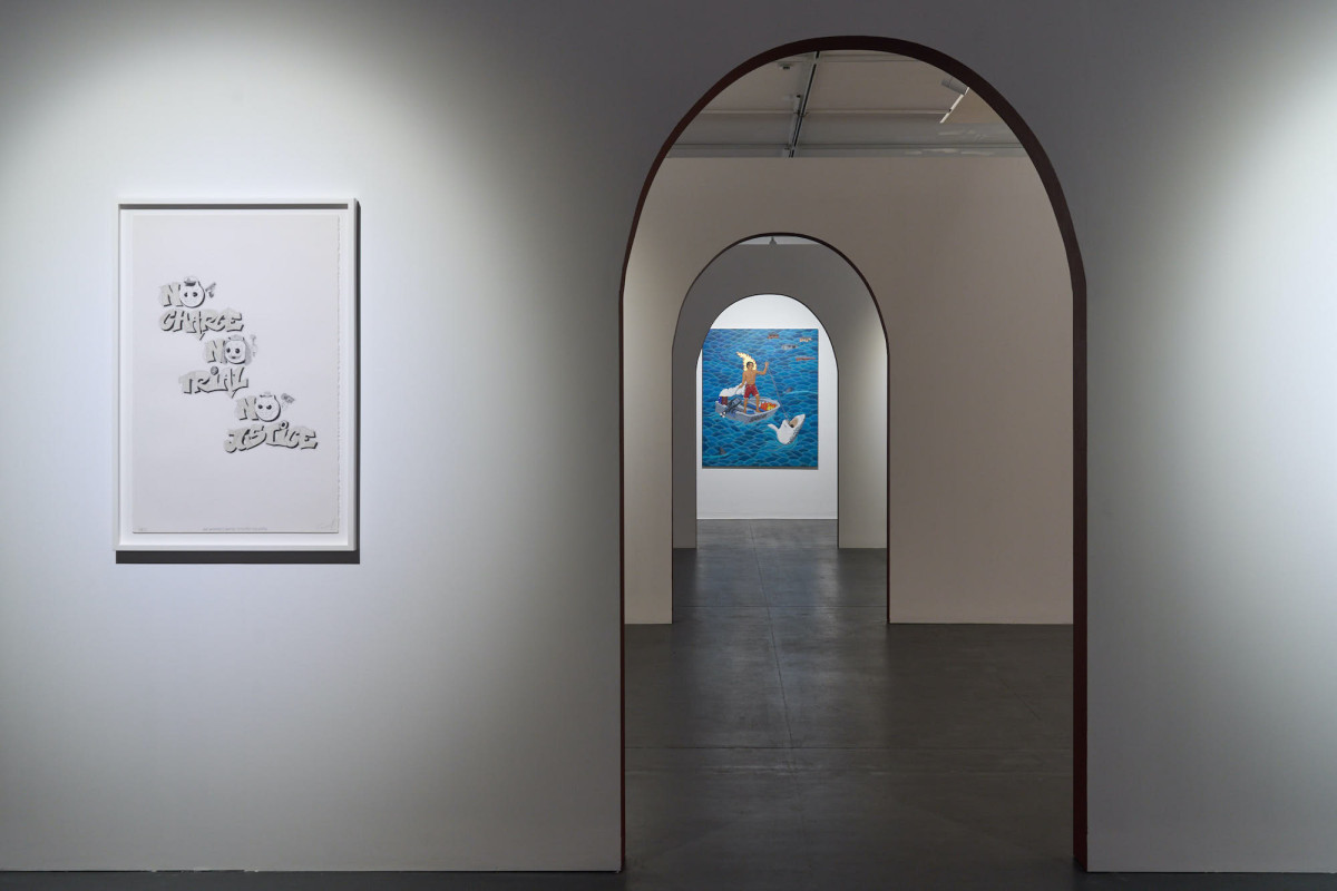 View of two artworks from the perspective of the front of the gallery.