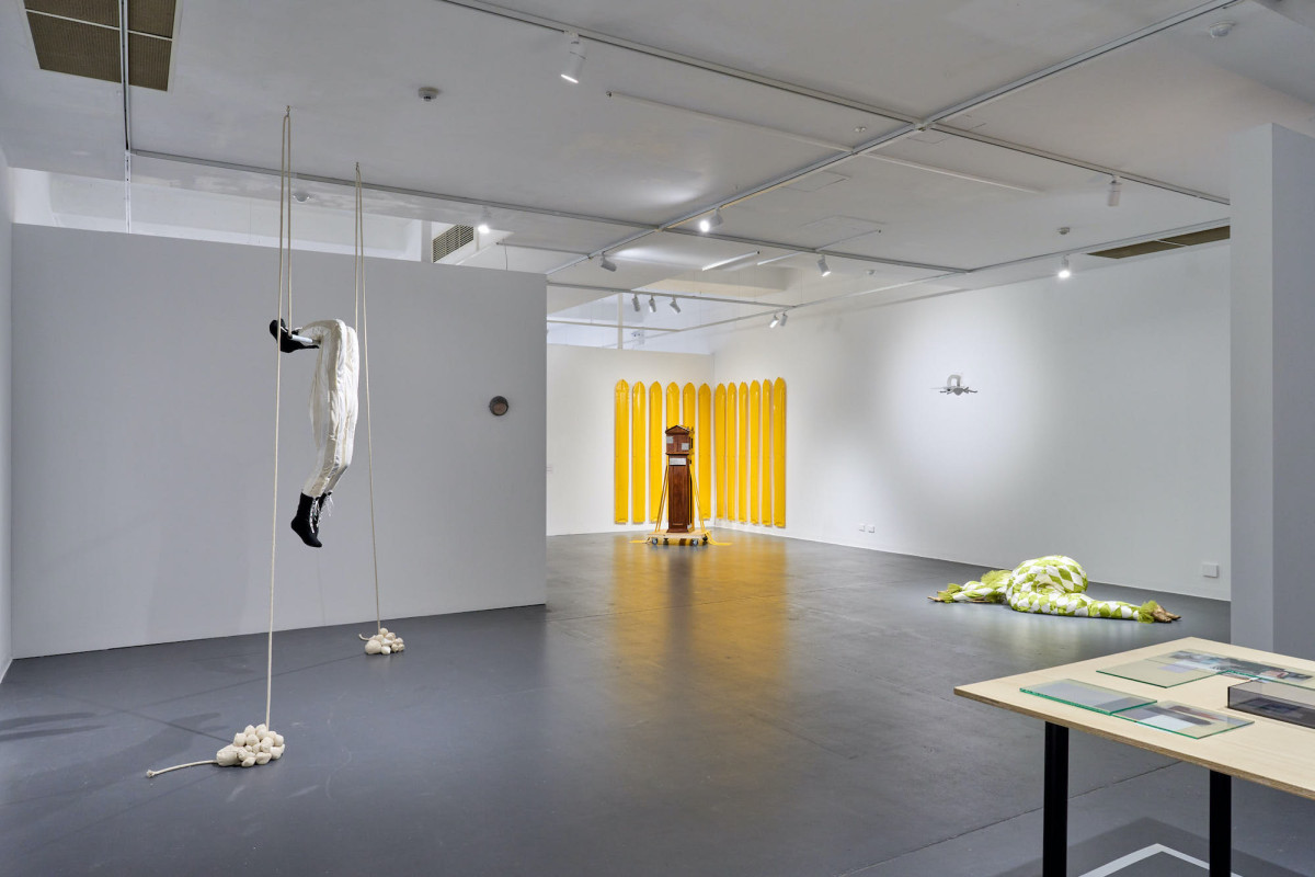 A wide view of various works in the gallery.