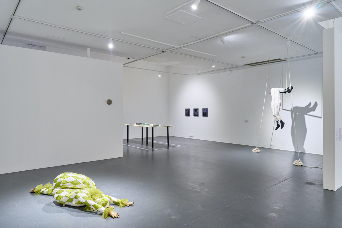 A wide view of various works in the gallery.