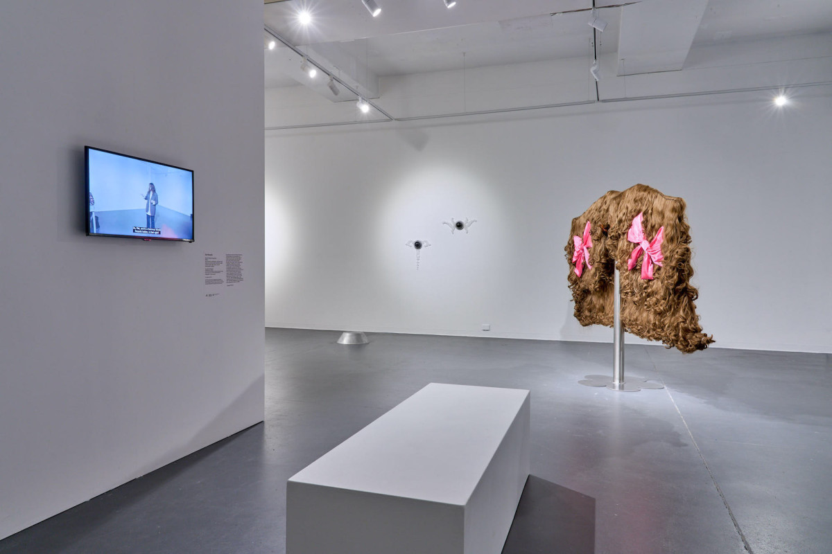 A wide view of various works in the gallery.