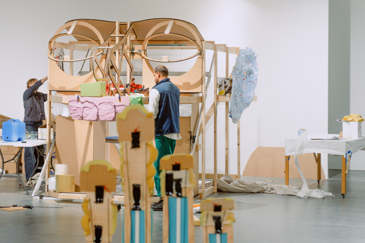 Two people working on ROCKAMORA in the skeleton stage.