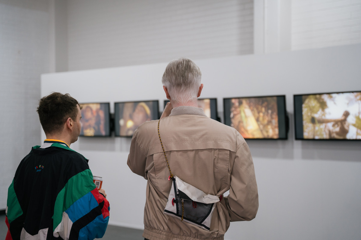 2 people watching 'Treaty' across 7 screens on opening night of 'Studios: 2023'.