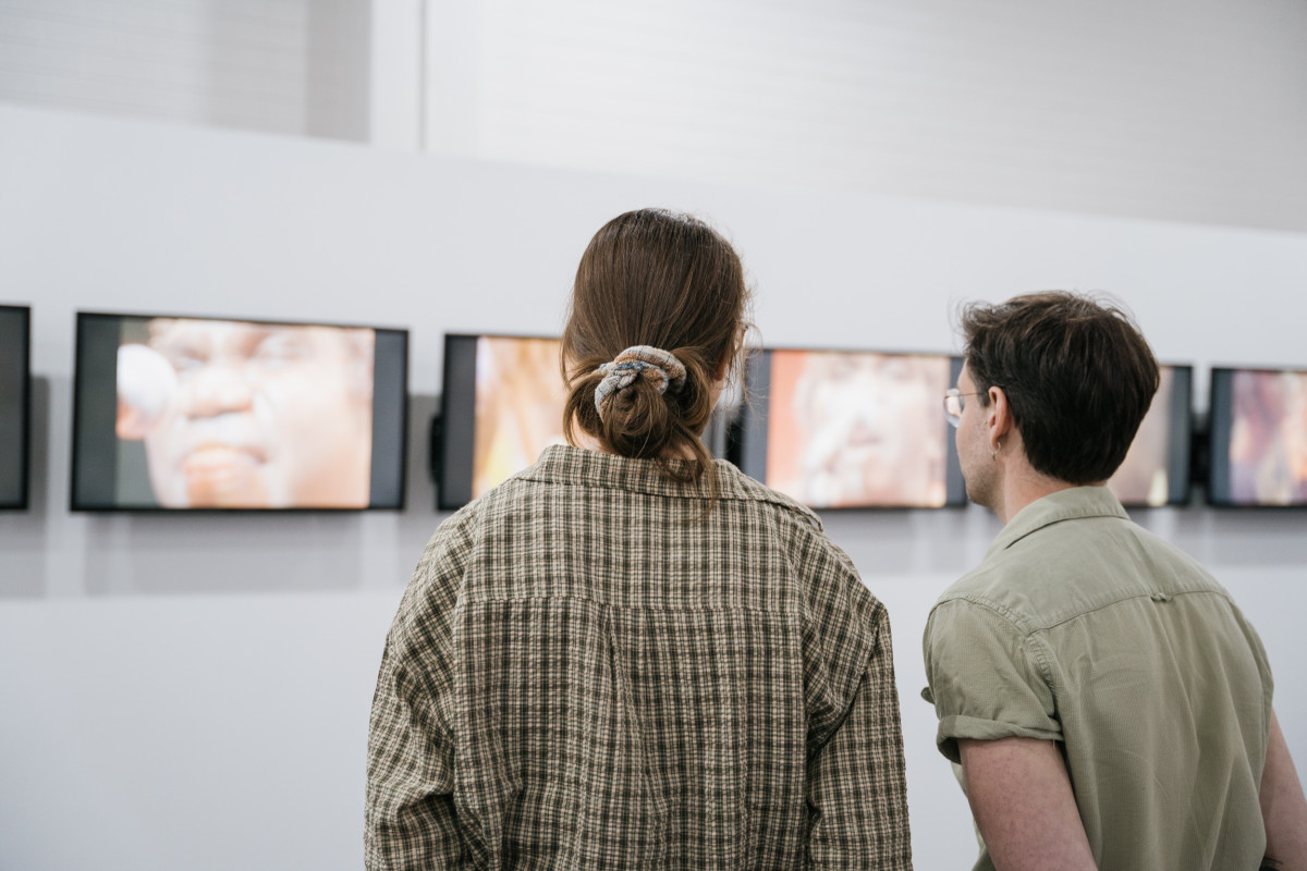 2 people watching 'Treaty' across 7 screens on opening night of 'Studios: 2023'.